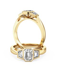An amazing emerald cut diamond ring with trapezium cut side stones in 18ct yellow gold