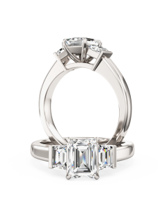 A wonderful emerald cut diamond ring with trapezium cut side stones in 18ct white gold