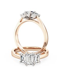 A beautiful emerald cut three stone diamond ring in 18ct rose & white gold