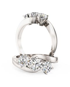 A unique round brilliant cut three stone diamond twist ring in 18ct white gold
