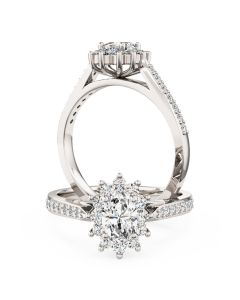 An oval diamond halo with diamond shoulders in 18ct white gold