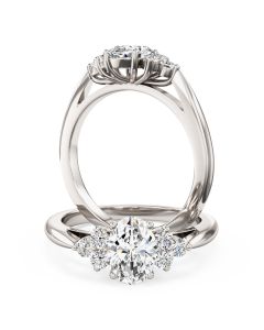 An oval and round brilliant cut diamond ring in 18ct white gold