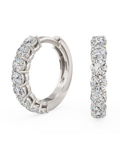 A beautiful pair of brilliant cut diamond huggie earrings in 18ct white gold