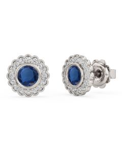 A beauitiful pair of round sapphire and diamond halo earrings in 18ct white gold
