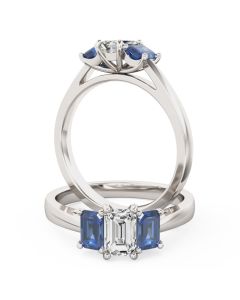 A beautiful emerald cut diamond and sapphire three stone ring in 18ct white gold