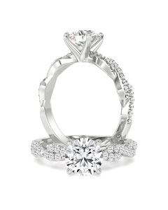 A stunning round brilliant cut diamond ring with shoulder stones in 18ct white gold